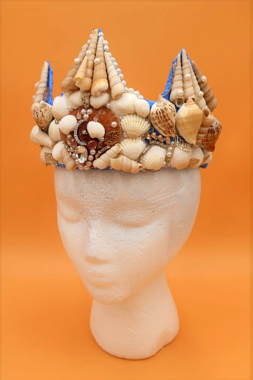 Learn how to make a beautiful DIY mermaid crown with real seashells!  This project is also a great way to use up old jewelry!